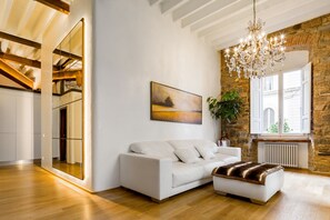 Luxury Suite, Multiple Beds | Living area | TV