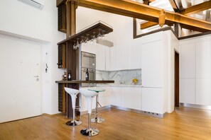 Luxury Suite, Multiple Beds | Private kitchen | Fridge, stovetop, cookware/dishes/utensils