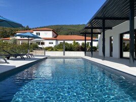 Seasonal outdoor pool, open 8:00 AM to 8:00 PM, sun loungers