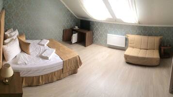 Standaard vierpersoonskamer | Een kluis op de kamer, verduisterende gordijnen, geluiddichte muren