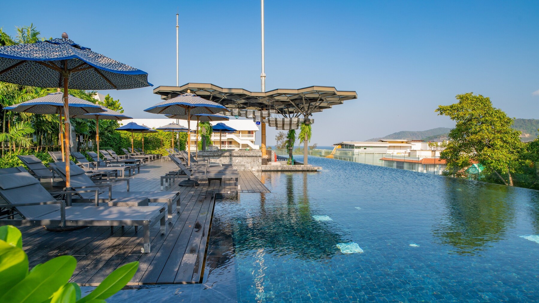 Outdoor pool, open 7:00 AM to 9:00 PM, pool umbrellas, sun loungers