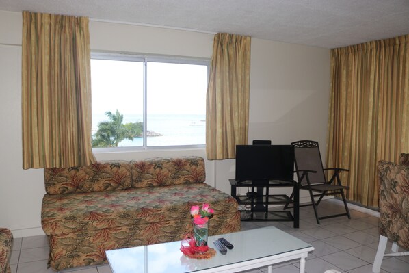 Economy Apartment, 1 Queen Bed, Non Smoking | Living room | Flat-screen TV - Angel Fish Beach Suites - Turtle Tower (Ocho Rios)