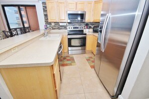 Apartment | Private kitchen | Fridge, oven, stovetop, coffee/tea maker - Sunrise 507 Apartment 2 (New Smyrna Beach)
