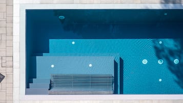 Seasonal outdoor pool, pool loungers