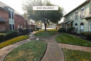 Stroll down this charming residential street lined with unique homes featuring traditional and modern architectural styles.