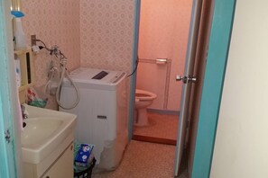 Separate bathtub and shower, free toiletries, hair dryer, slippers