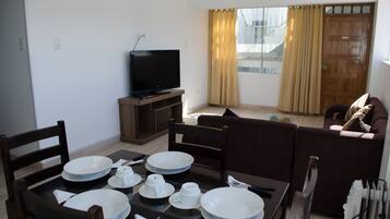 Apartment, 2 Bedrooms | Living room | Flat-screen TV