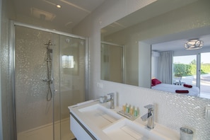 Shower, hair dryer, towels, soap