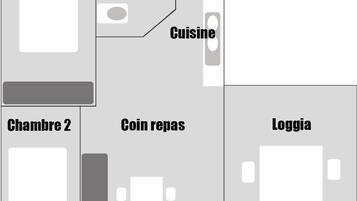 A hotel layout with two rooms, a bathroom, a kitchen, a dining area, and a storage room.