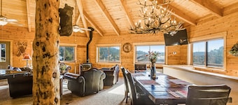 Large family-friendly cabin with game room, hot tub, & wraparound deck