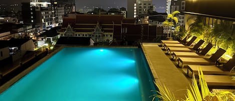 Outdoor pool, open 8 AM to 8 PM, pool loungers