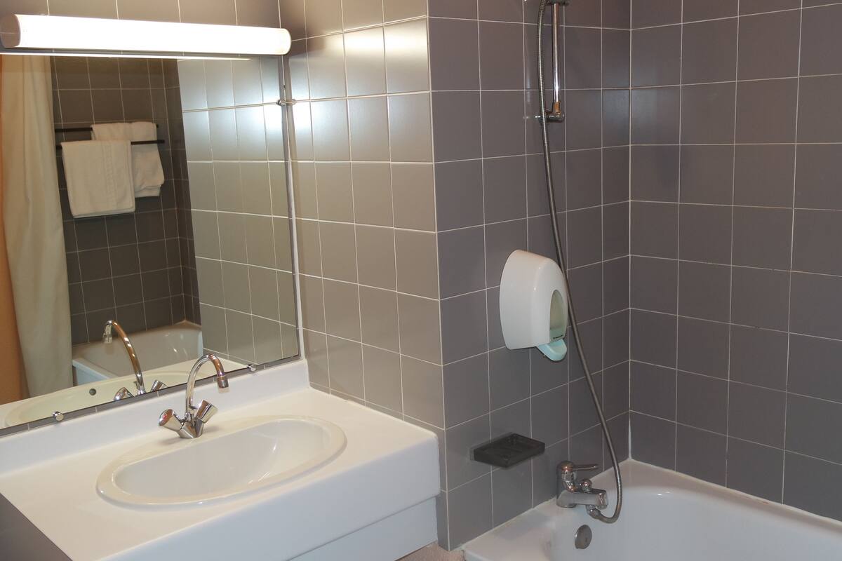 deep-soaking bathtub, rainfall showerhead, free toiletries, hair dryer