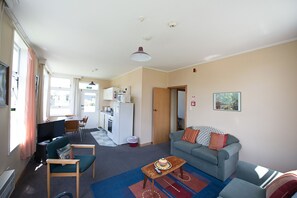 Apartment, 3 Bedrooms | Living area | Flat-screen TV