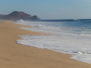 On the beach, sun loungers, beach towels