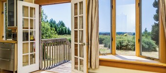 Classic farmhouse with front porch & amazing sunset views - walk to town