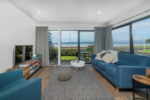 Living area - Modern beach front apartment at Aqua Soleil complex with lap pool & spa. (Whitianga)