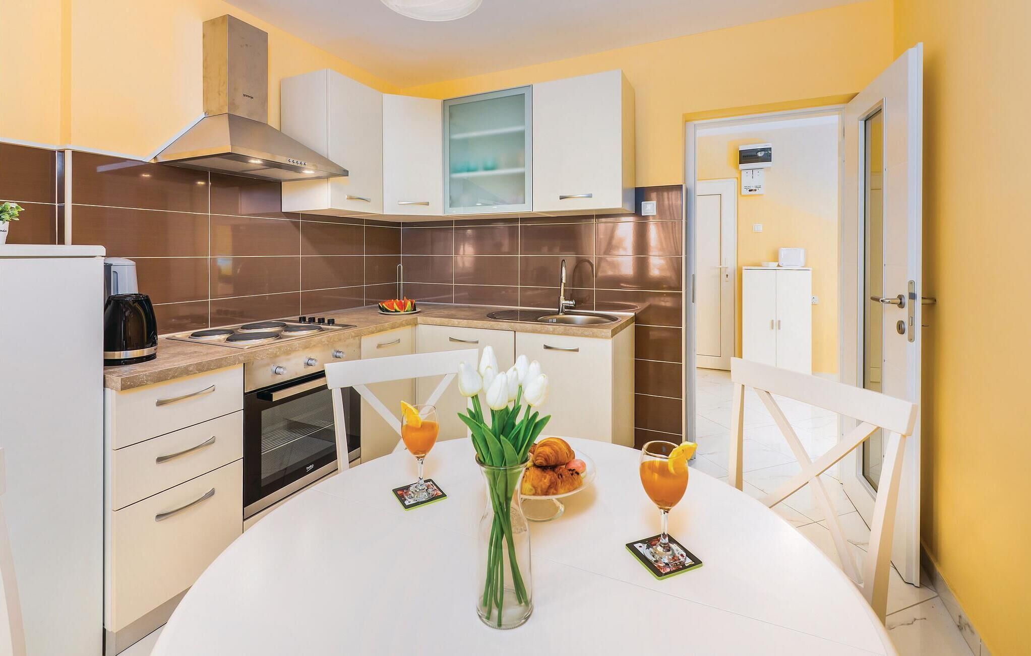 Fridge, stovetop, dishwasher, coffee/tea maker