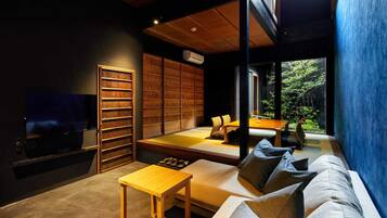 Traditional House with Semi-open-air-bath | Living area | Flat-screen TV