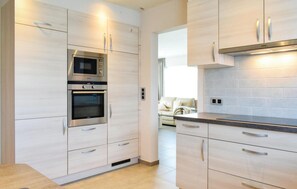 Fridge, stovetop, dishwasher, coffee/tea maker