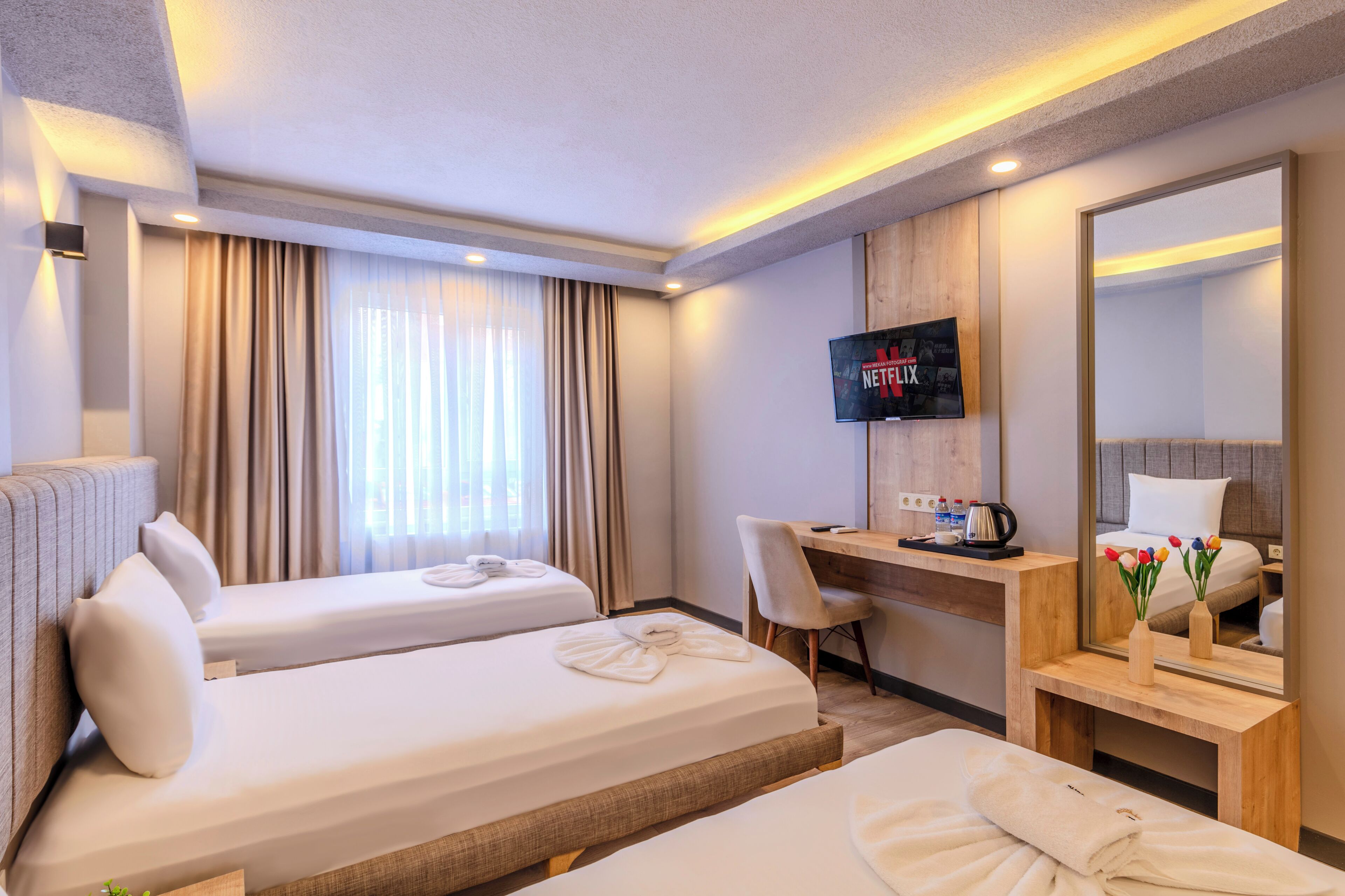 triple room | premium bedding, desk, laptop workspace, blackout curtains