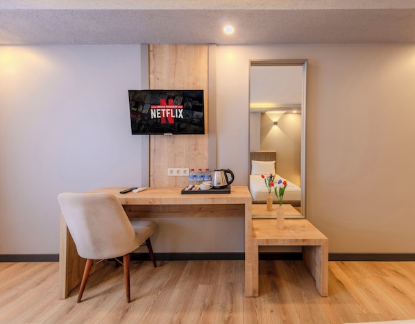 Premium bedding, desk, laptop workspace, blackout drapes