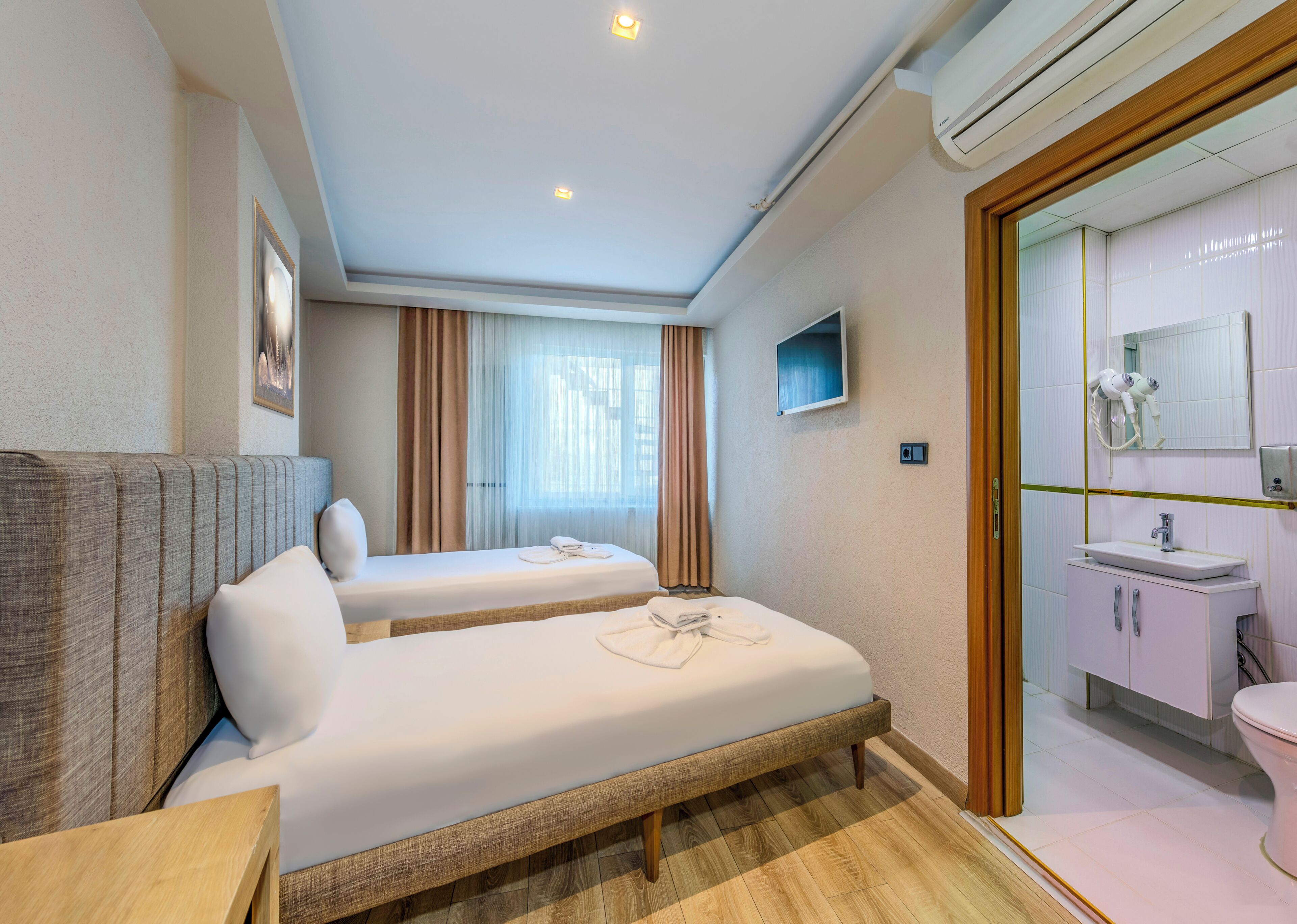 standard twin room | premium bedding, desk, laptop workspace, blackout curtains