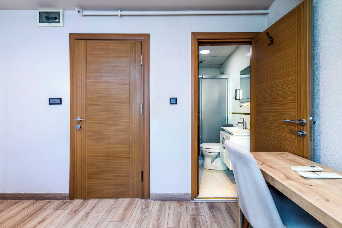 deluxe single room | premium bedding, desk, laptop workspace, blackout curtains