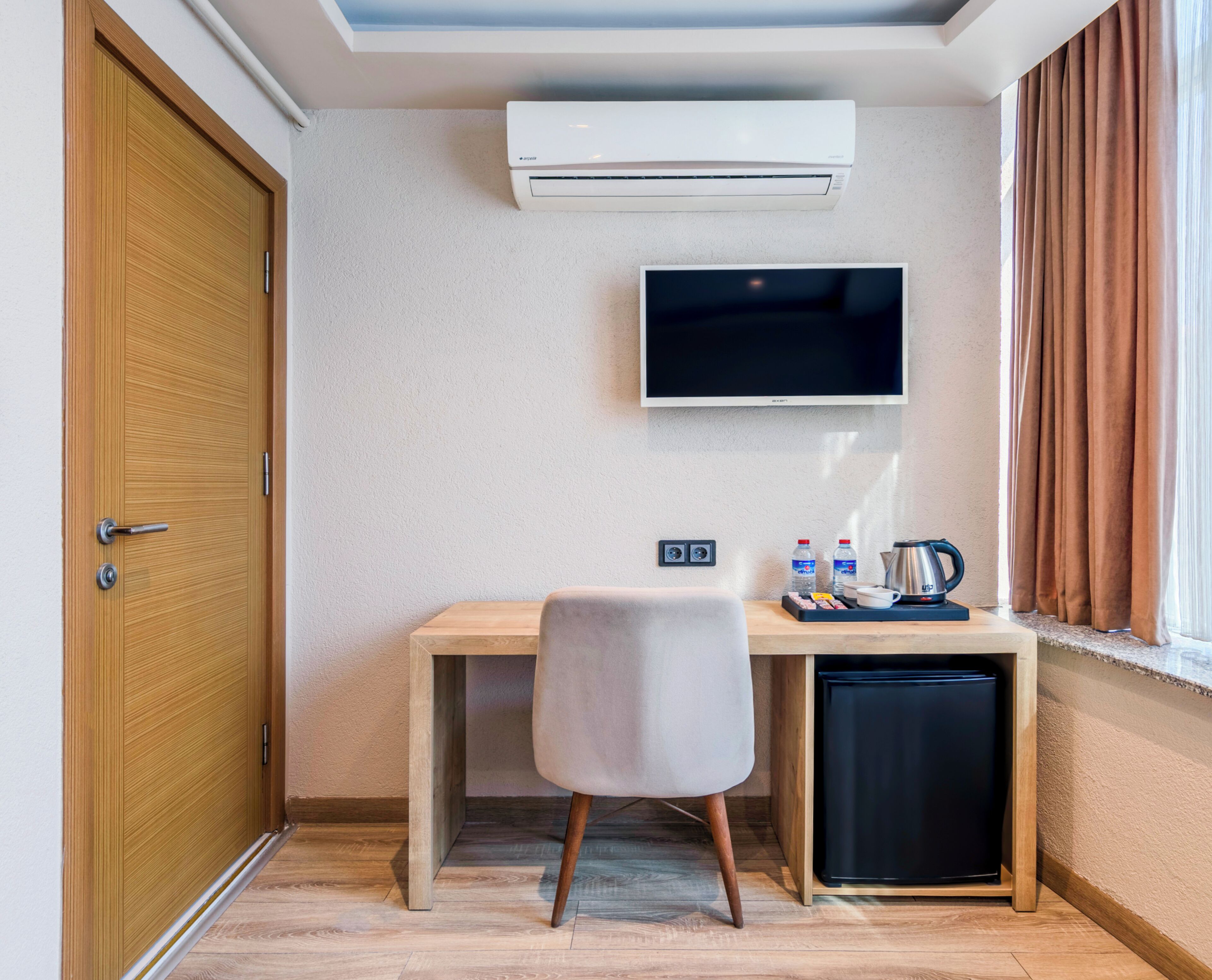 deluxe single room | premium bedding, desk, laptop workspace, blackout curtains