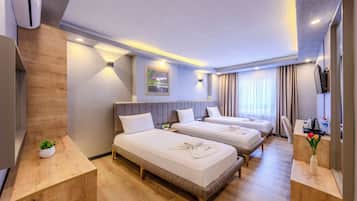 Triple Room | Premium bedding, desk, laptop workspace, blackout drapes