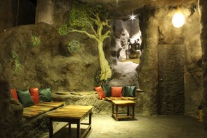 Luxury Cave | Living area | LED TV, fireplace - Tathastu Pench (Kurai)