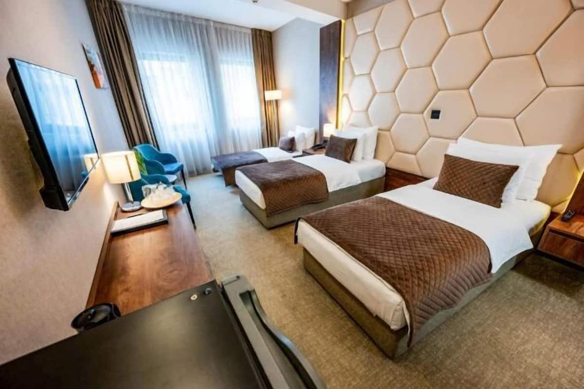 Ropa de cama hipoalergénica, minibar, caja fuerte