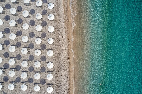 On the beach, black sand, free beach shuttle, sun-loungers