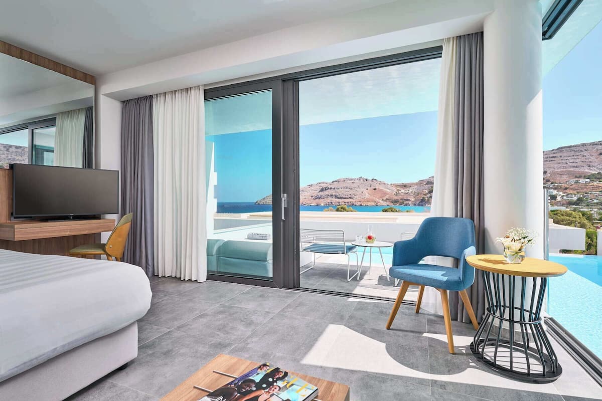 Deluxe Double Room, Sea View, Private Pool | Minibar, in-room safe, blackout drapes, soundproofing