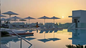 Indoor pool, outdoor pool, pool umbrellas, sun loungers