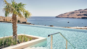 Indoor pool, outdoor pool, pool umbrellas, sun loungers