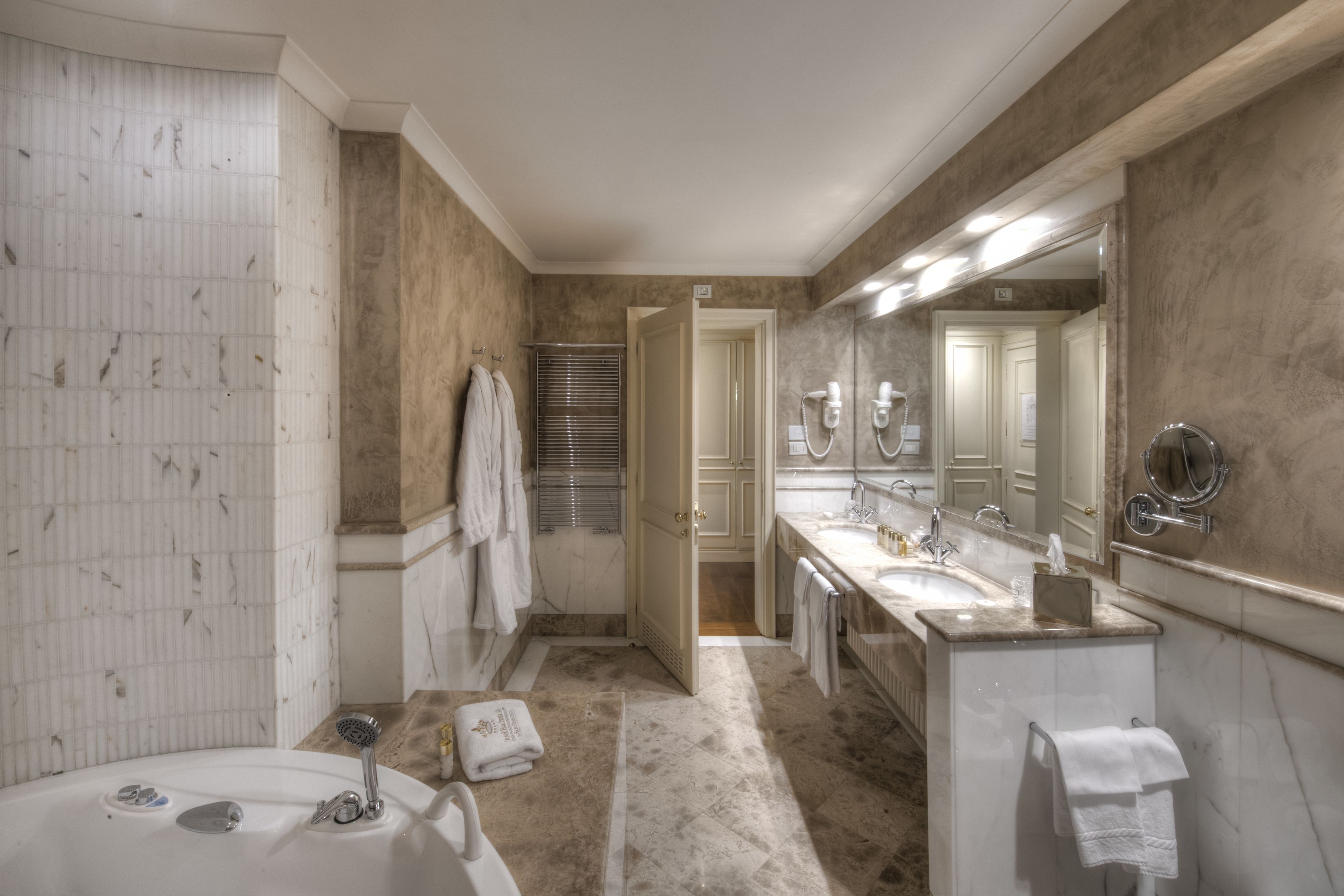 junior suite | bathroom | separate bathtub and shower, jetted bath, free toiletries, hair dryer