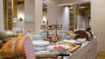 A buffet setup with various food items and condiments.