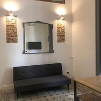 Design Apartment | Living area | 32-inch LED TV with cable channels