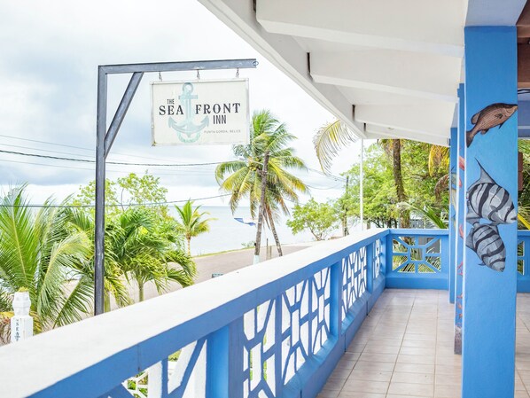 A balcony with a sign for 'The Sea Front Inn' in Punta Gorda, Belize. - Sea Front Inn (Punta Gorda)