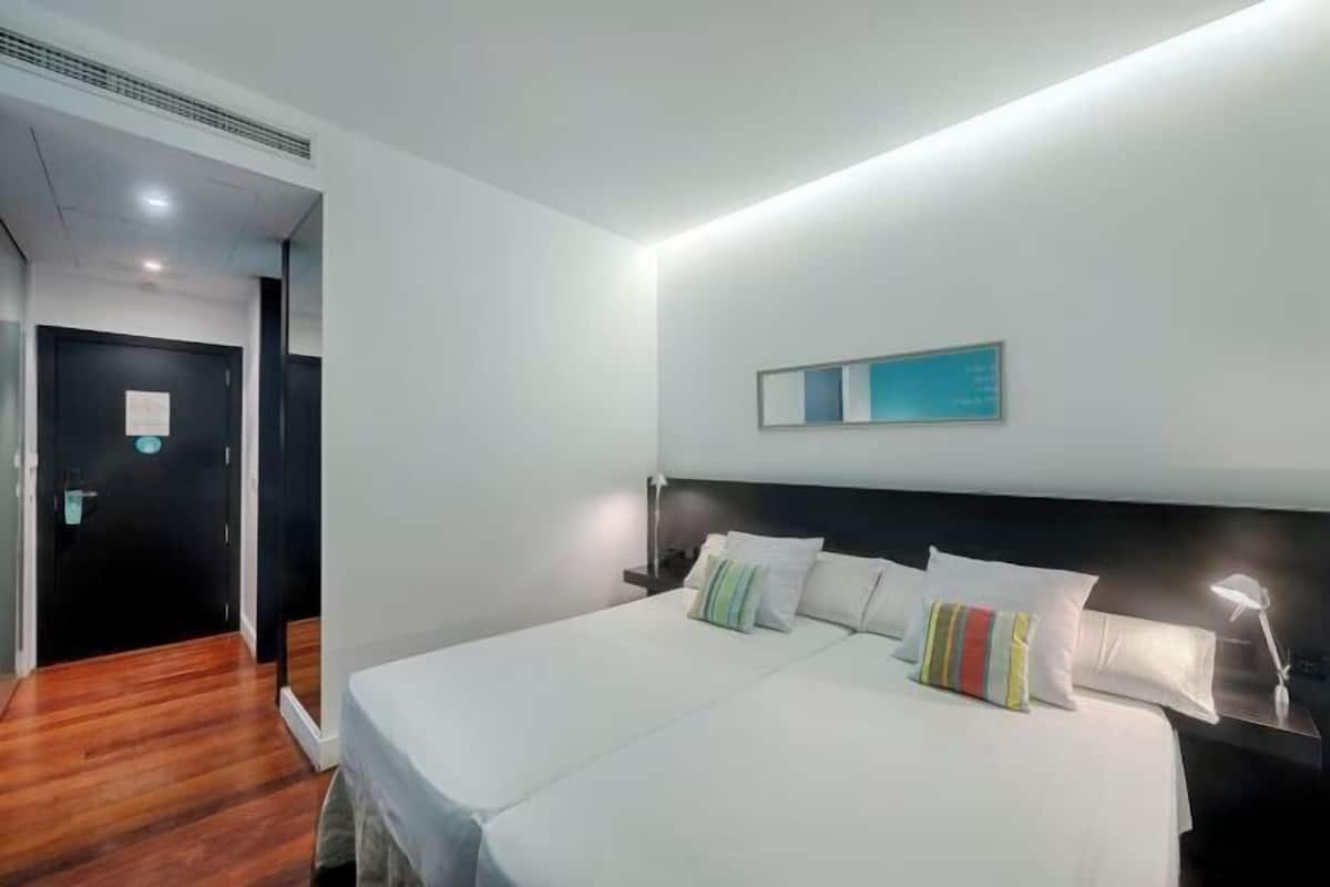 Down duvets, memory-foam beds, in-room safe, desk