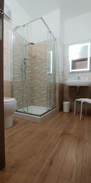 Quadruple Room, Balcony | Bathroom | Shower, free toiletries, hair dryer, bathrobes