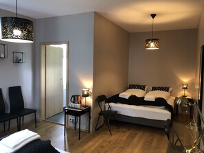 Family Quadruple Room, Private Bathroom | Minibar, desk, laptop workspace, blackout drapes