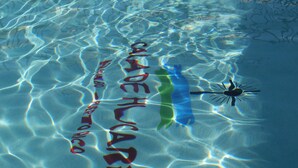 A pool with clear water and a sign that reads "CAJA DE ALAJES." - Come and Stay with us.   we are unaffected by the drought.  (Naguabo)