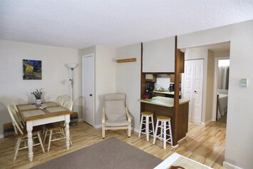 Living Room with Dining Table in Waterville Valley Vacation Condo