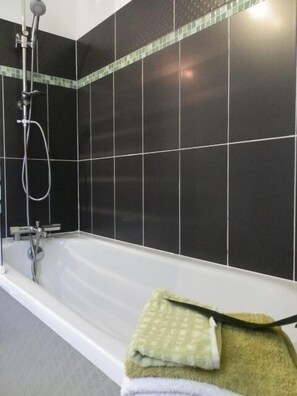 Combined shower/tub, hair dryer, towels, toilet paper
