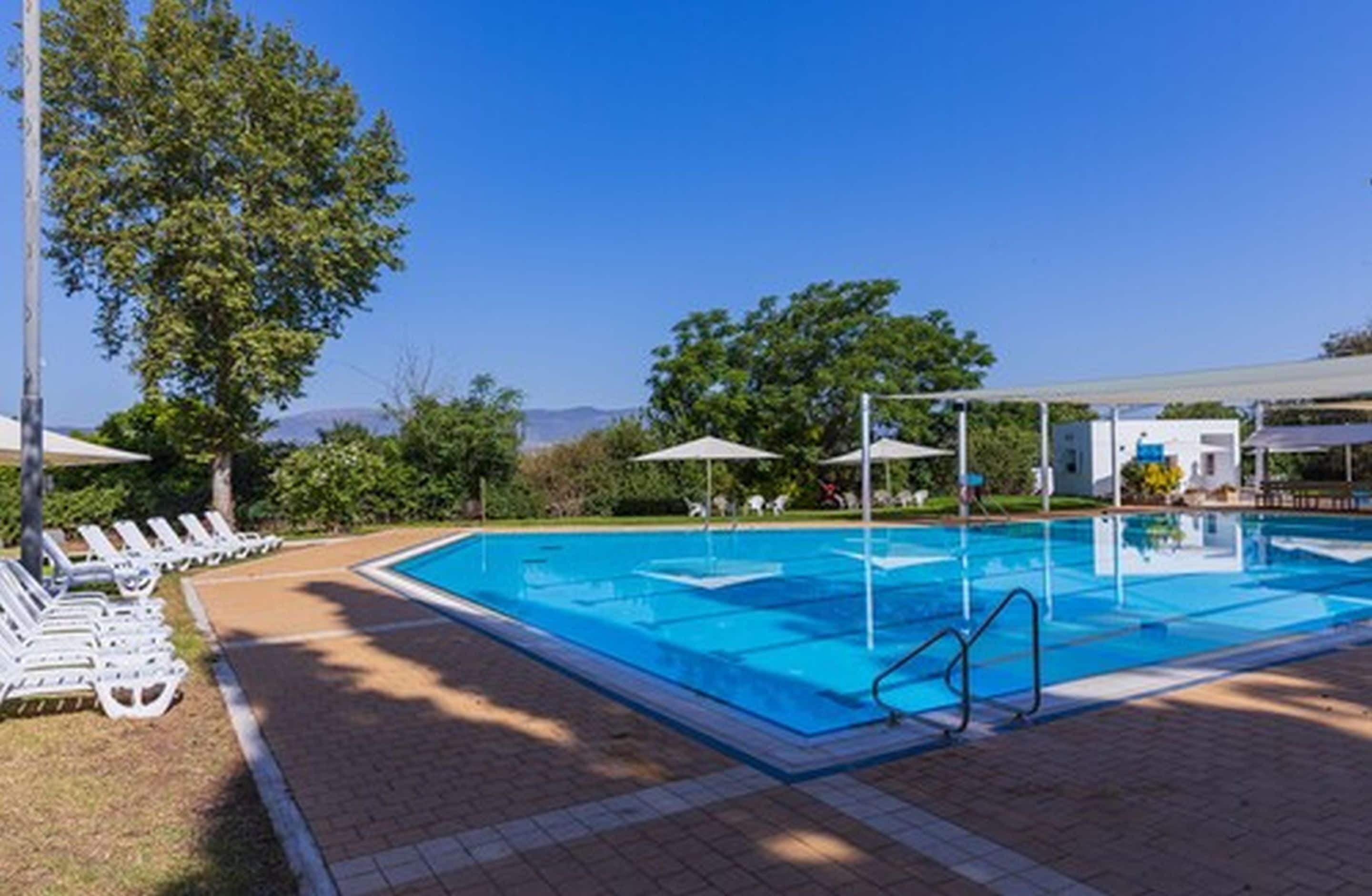 Seasonal outdoor pool, open 10:00 AM to 6:00 PM, sun loungers