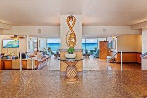 Experience the grandeur of our lobby, featuring a striking infinity design, polished floors, and comfortable seating areas.