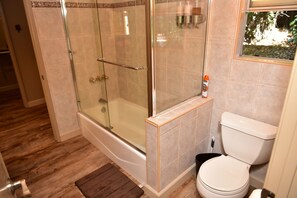 Combined shower/tub, hair dryer, towels, soap