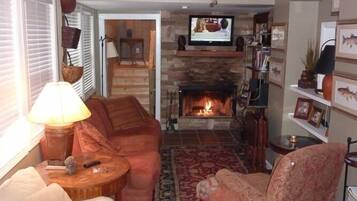TV, fireplace, books, stereo