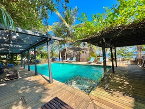 Outdoor pool, open 7 AM to 7 PM, pool umbrellas, pool loungers